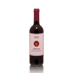 A bottle of Monica di Sardegna wine from Italy standing on a gray background